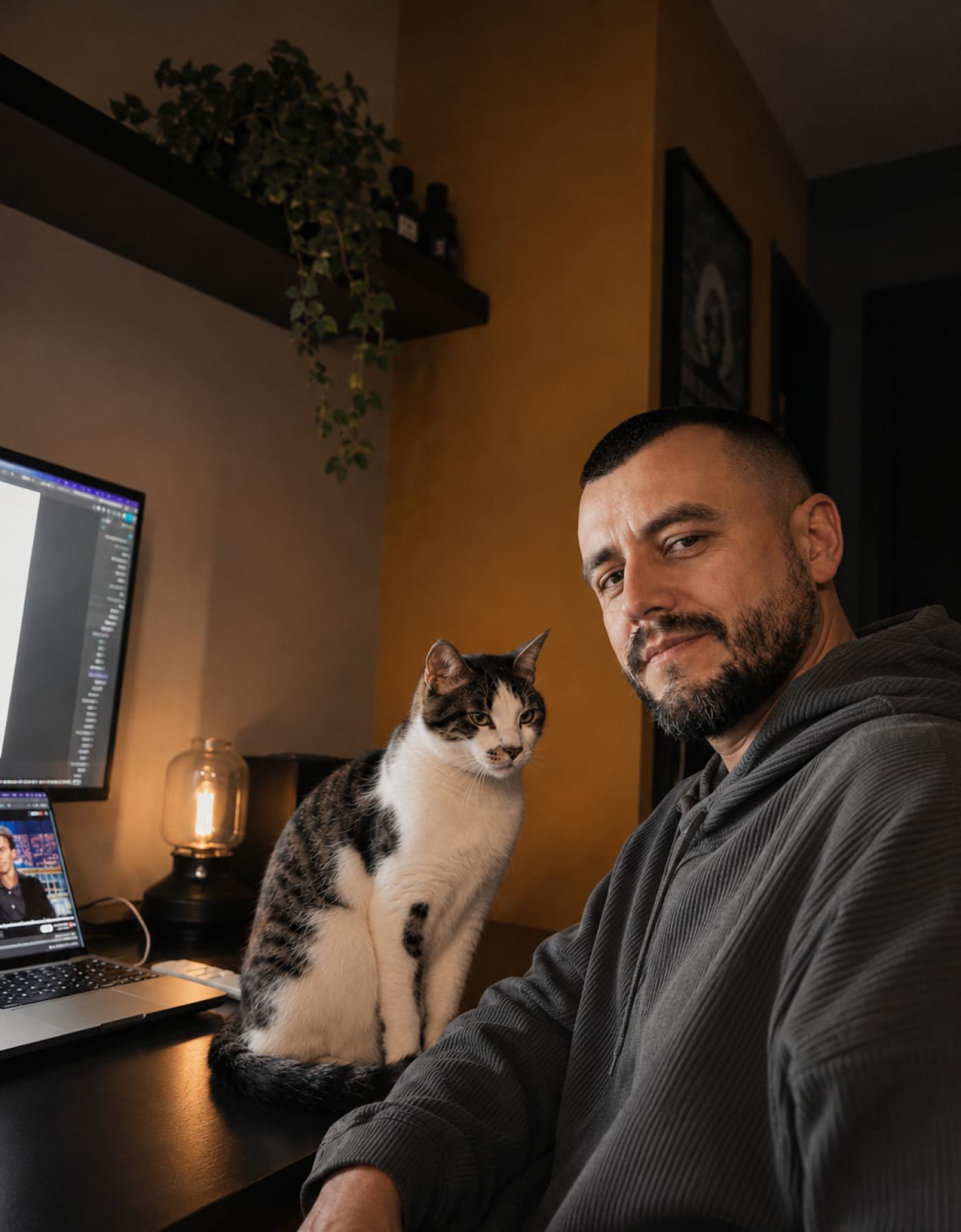 Igor at his desk with his cat